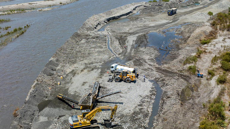 Construction machinery near a river