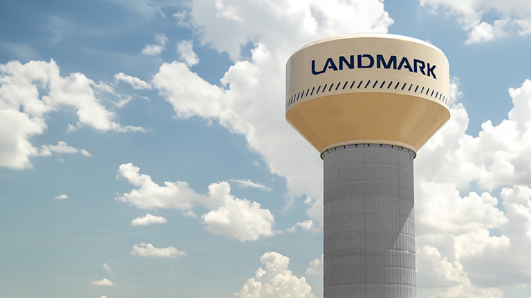 A water tower with Landmark's logo in it