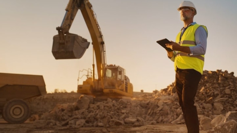 A contractor standing at in a construction site