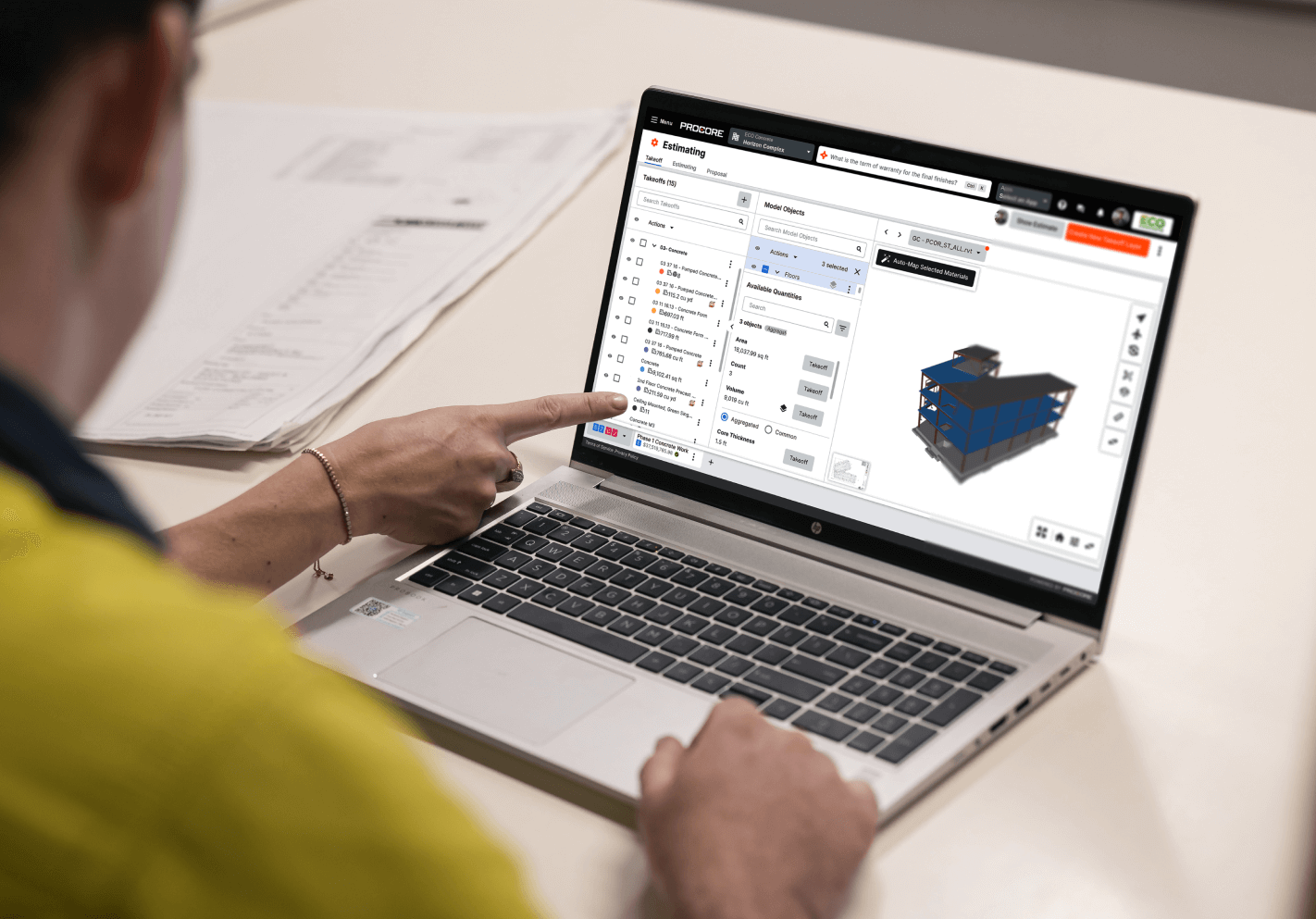 Two people working with BIM in a laptop
