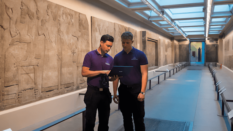 Two men looking at a tablet