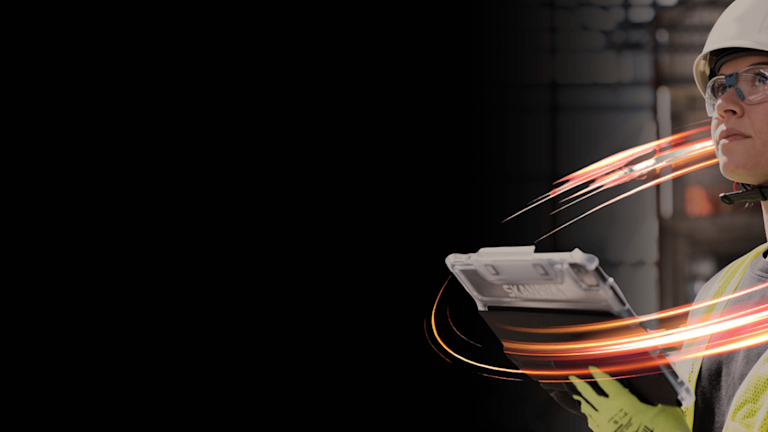 Construction worker reviewing plans on site